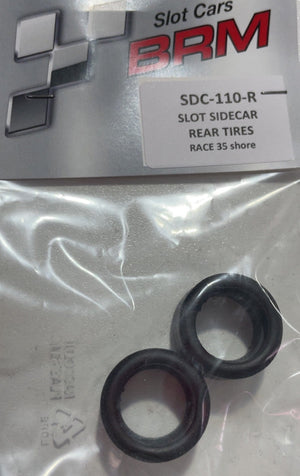 A pair of black rubber rear tires for slot cars, sealed in a clear plastic bag with a branded BRM header card. The card reads 'Slot Cars BRM SDC-110-R Slot Sidecar Rear Tires'.