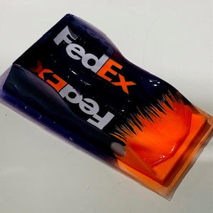A 1/24 scale model of a FedEx painted Peugeot Diablito 0.07 LMP racing car body.