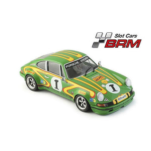 A green Porsche 911 race car model with yellow and orange sponsor decals, number 1 on the windshield and side, shown on a white background with a Slot Cars BRM logo in the top right.